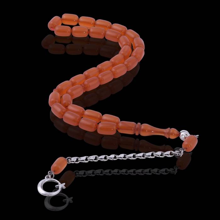 Capsule Cut Squeezing Amber Rosary